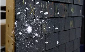 hailstone-shattering-against-shingles-in-lab