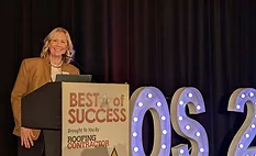 Jill Bloom at podium during The Best of Success Conference in 2025