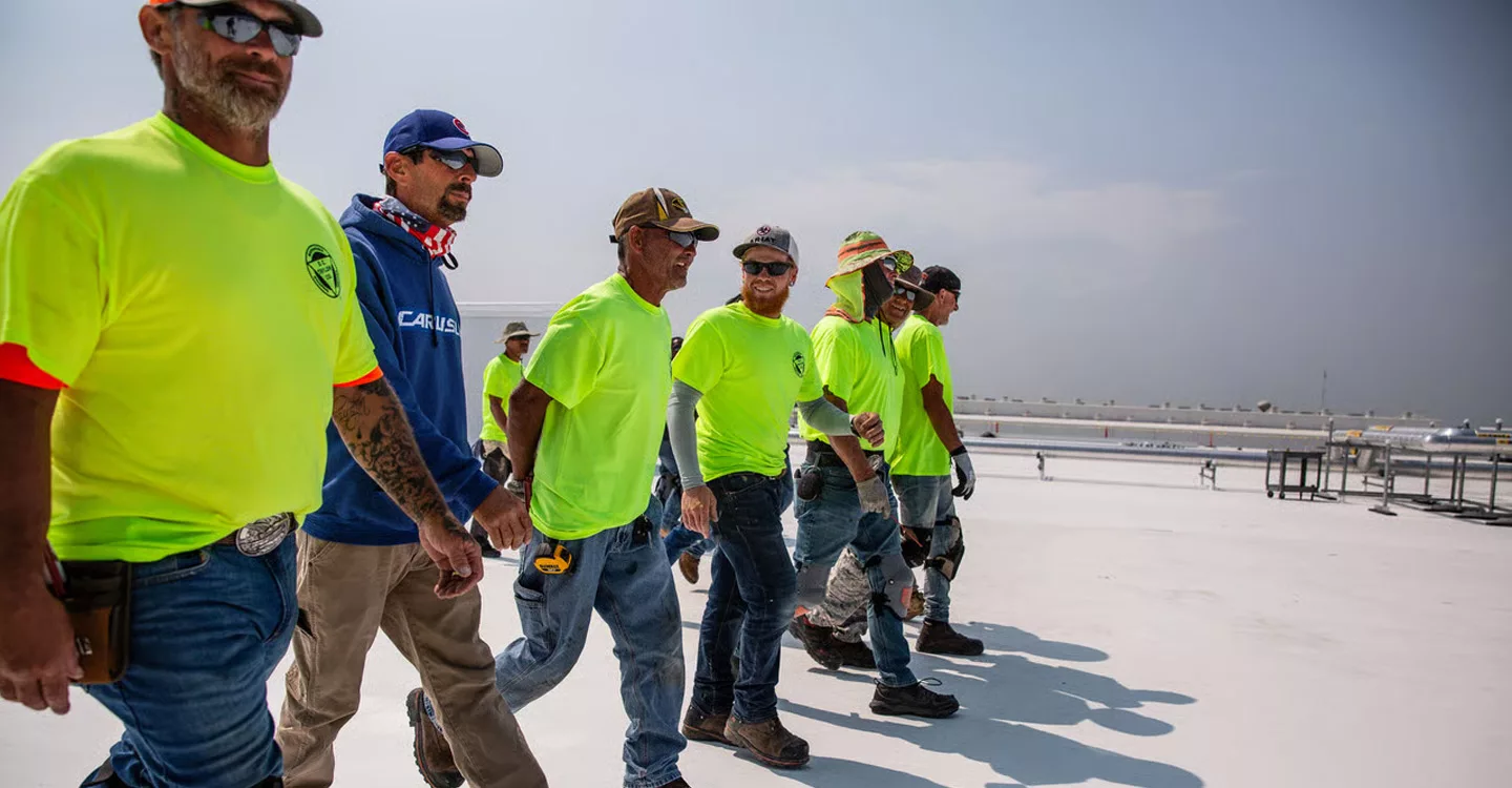 A roofing crew on a roof