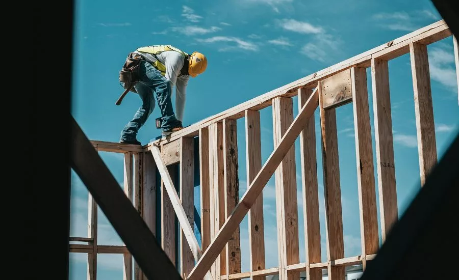 construction worker framing a building