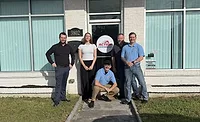 Action Roofing team in front of Pensacola office