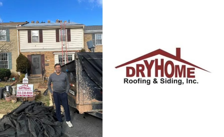 Sougata Roy in front of roof replacement