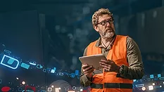 A construction worker surrounded by so much data