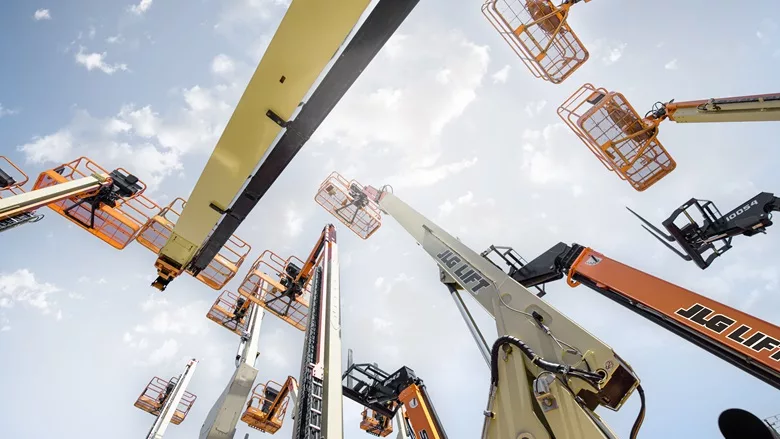 A level shot of various JLG booms looking upward