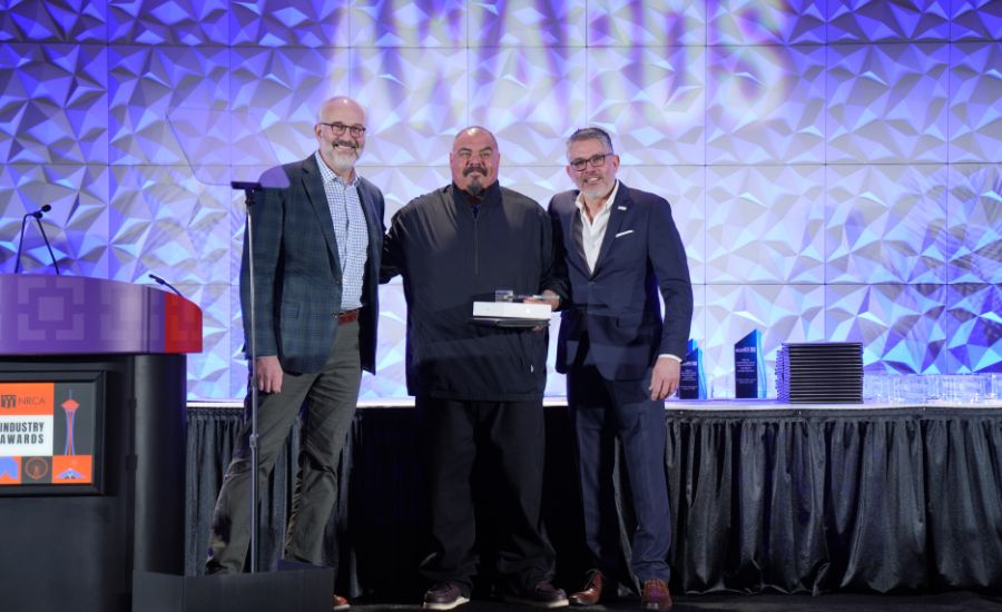 Armando Landeros Solis accepts NRCA award