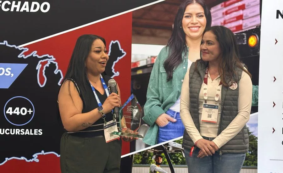 Claudia Carachure accepts the award