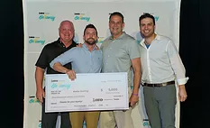 Steller Roofing team accepts award check