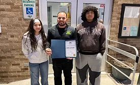 Ruben Gonzalez poses with his award with his daughter Ava Gonzalez and nephew Pablo Marquez
