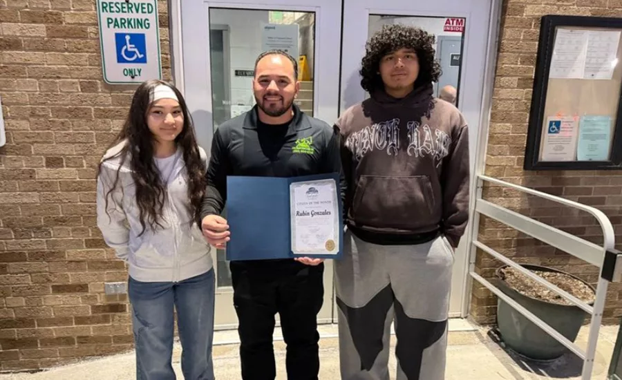Ruben Gonzalez poses with his award with his daughter Ava Gonzalez and nephew Pablo Marquez
