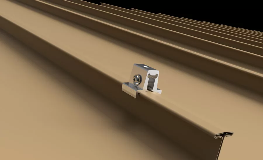 New S-5-TH Clamp Simplifies Solar Mounting on Metal Roofs Silver clamp on a tan corrugated metal roof panel