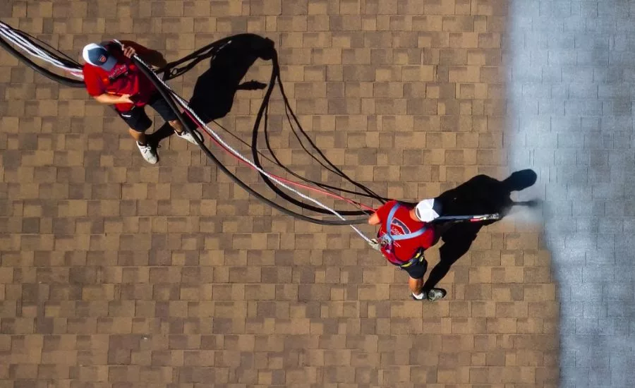 two contractors apply the product