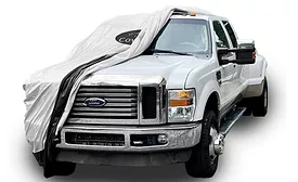 Work truck covered with a CoverSeal protective cover parked outdoors.