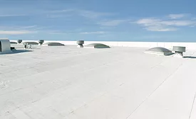 Low-slope commercial roof with Flintlastic SA Cap CoolStar Ultra self-adhered reflective membrane