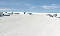Low-slope commercial roof with Flintlastic SA Cap CoolStar Ultra self-adhered reflective membrane