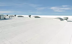 Roof with Flintlastic SA Cap CoolStar Ultra Low-slope commercial roof with Flintlastic SA Cap CoolStar Ultra self-adhered reflective membrane