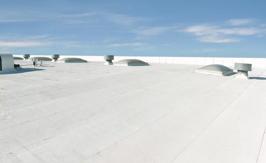 Low-slope commercial roof with Flintlastic SA Cap CoolStar Ultra self-adhered reflective membrane