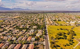 Aerial view of a suburban neighborhood in Arizona with clear skies.