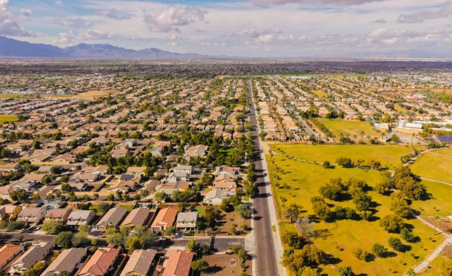Aerial view of a suburban neighborhood in Arizona with clear skies.