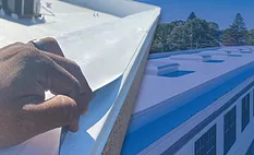 A layeresd image including metal roofing