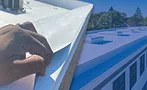 A layeresd image including metal roofing