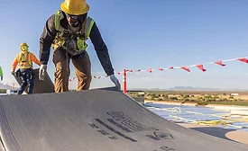 Roofers installing DexCell coverboards