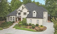 Owens Corning TDDURATION_WilliamsburgGray.jpg Gray shingles on residence