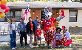 group in front of residence
