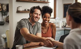 A young couple happily agrees to buy a new roof because of financing options the roofing contractor was able to offer
