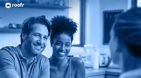 What homeowners actually want from their roofer A happy couple agreeing to purchase a new roof for their home