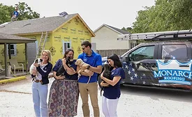 Monarch roofing team with pets