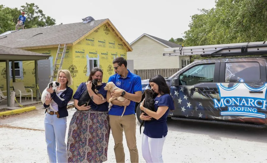 Monarch roofing team with pets