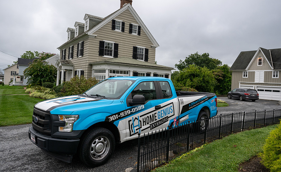 A work truck from Home Genius Exteriors