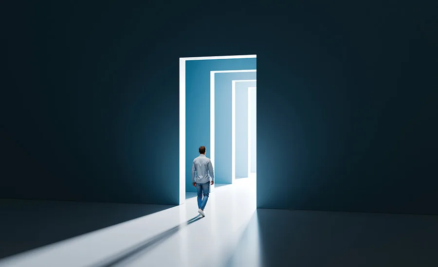 Exit Planning A man walking through a very dramatic door
