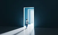 Exit Planning A man walking through a very dramatic door