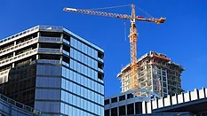 A Crane A crane towering over a commercial construction site