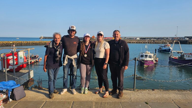 From left, boat captains Fred Mardle and Harry Mardle join swimmer Megan Woodworth, her sister and support crew member Emily Silverman, and Rob Knight Smith following Woodworth’s English Channel crossing.