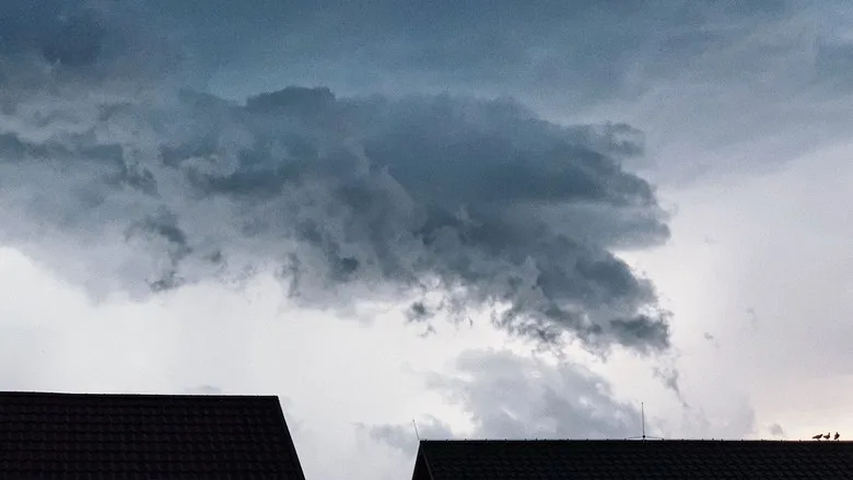 storm clouds over roof