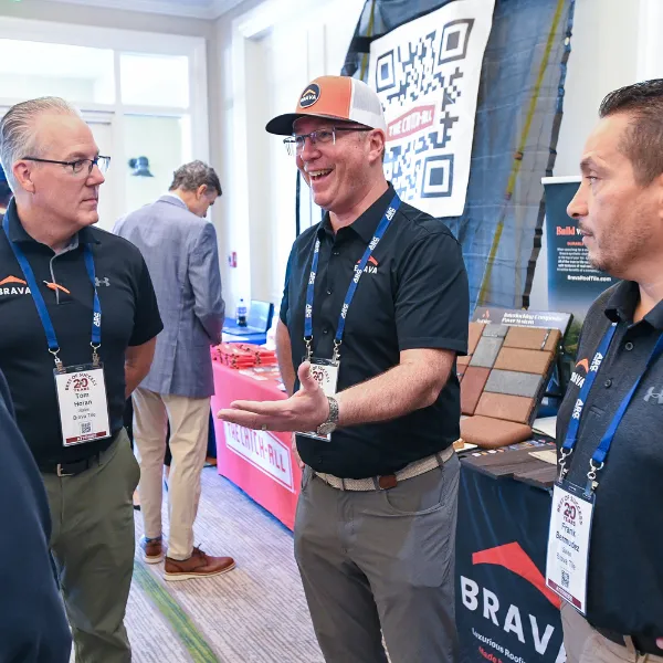 Roofing pros exchanging ideas at Best of Success conference
